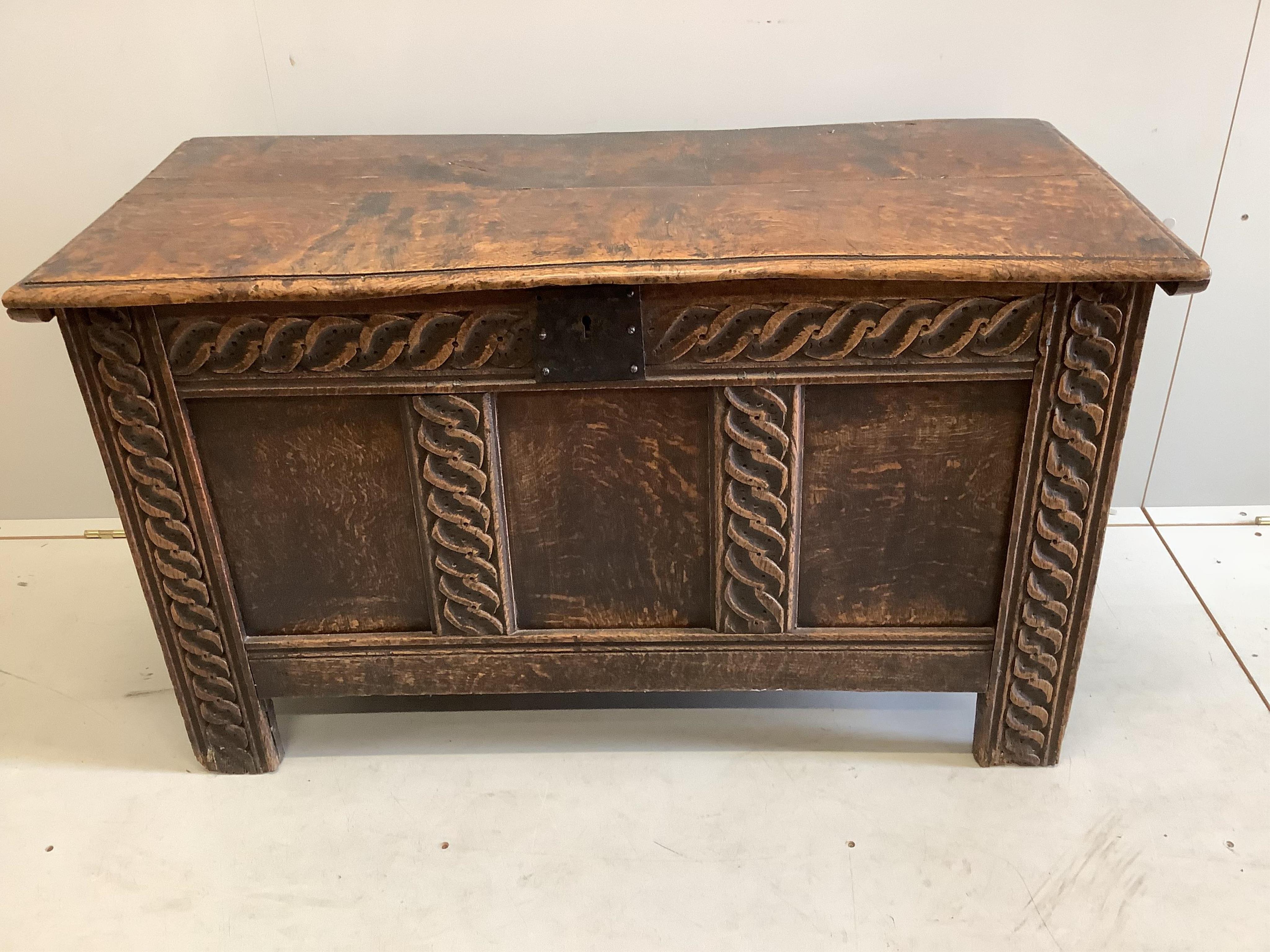 A 17th century panelled oak coffer, width 106cm, depth 48cm, height 61cm. Condition - fair